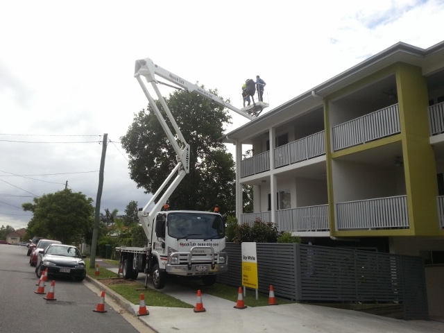 Crane lifted for gutter guard
