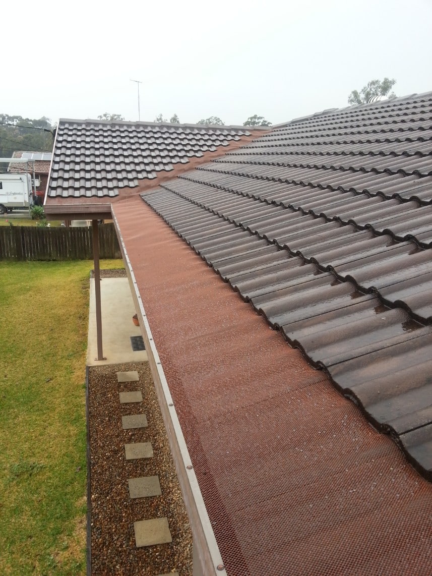gutter guard on tile roof and up on to valley
